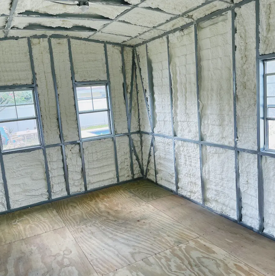 Closed-cell spray foam insulation applied to wall cavities in a residential project in Greenacres
